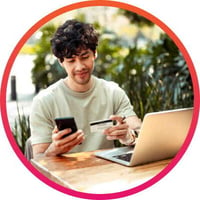 Young man reloading his gift card using his mobile phone