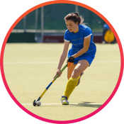 Girl playing field hockey