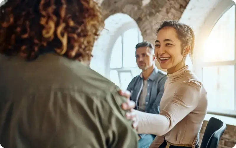 Church participant talking to another member