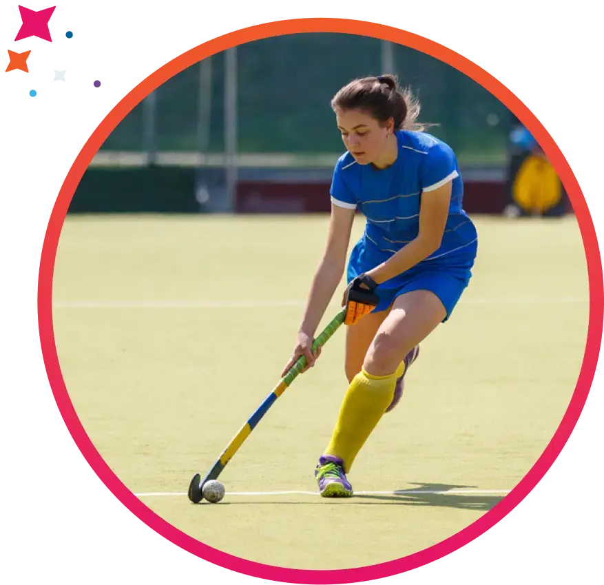 Girl playing field hockey